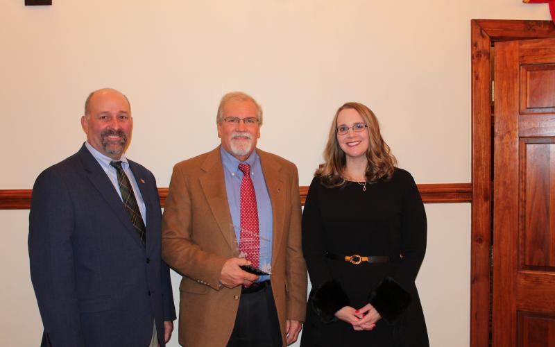 Dean Scarborough (center) received the council member of the year award from the Georgia Mountains Regional Commission. Making the presentation were GMRC chairman Sam Norton (left) and GMRC executive director Heather Feldman (right).