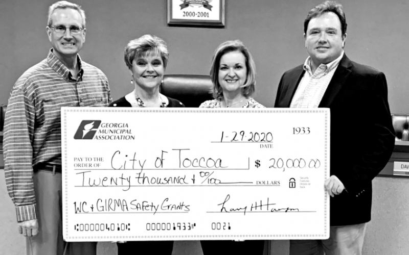 Exhibiting one of the giant GMA checks are (from left) city manager Billy Morse, city human resources director  Jan Crawford, GMA representative Brenda Eckman and Toccoa Mayor Terry Carter.