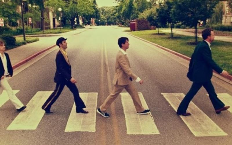 Members of Abbey Road Live! restage the iconic Beatles album cover photograph.