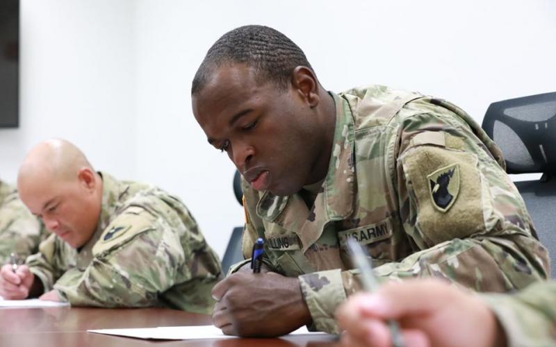 Army Spec. Isaac Swilling (right) concentrates on a test during a recent soldier of the year competition. Swilling is based at Andersen Air Force Base in Guam. He’s the son of former SCHS standout Ken Swilling.