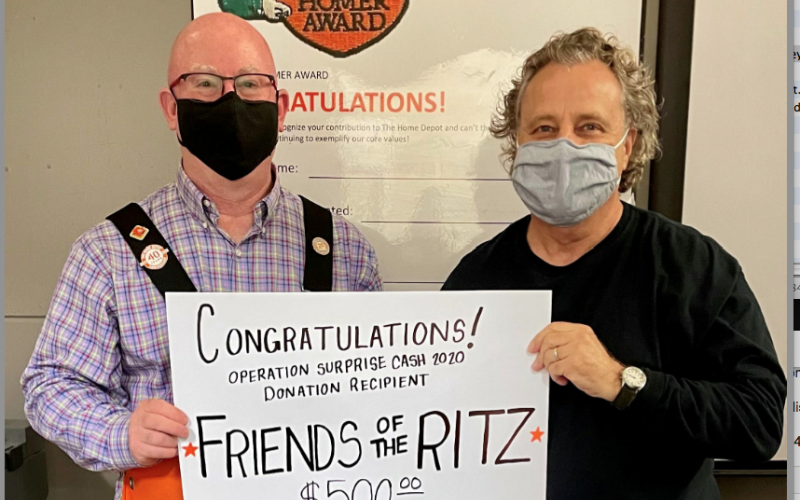 Wesley Copelan (left) of Home Depot and Friends of the Ritz president Gary Cortellino (right) celebrate the $500 Home Depot Operation Surprise grant.