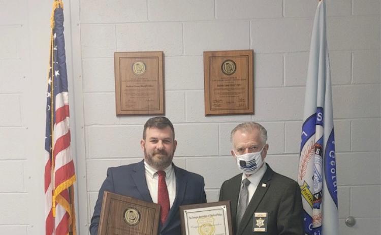 Stephens County Sheriff’s Office certification manager Lt. Stephen Stewart (left) and sheriff Randy Shirley display recertification plaques.