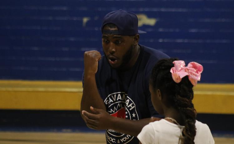 Eric Perry demonstrates in a boxing clinic 