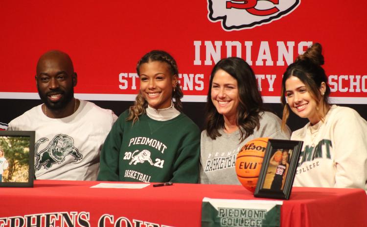 Kiki Howard and family during her signing ceremony 