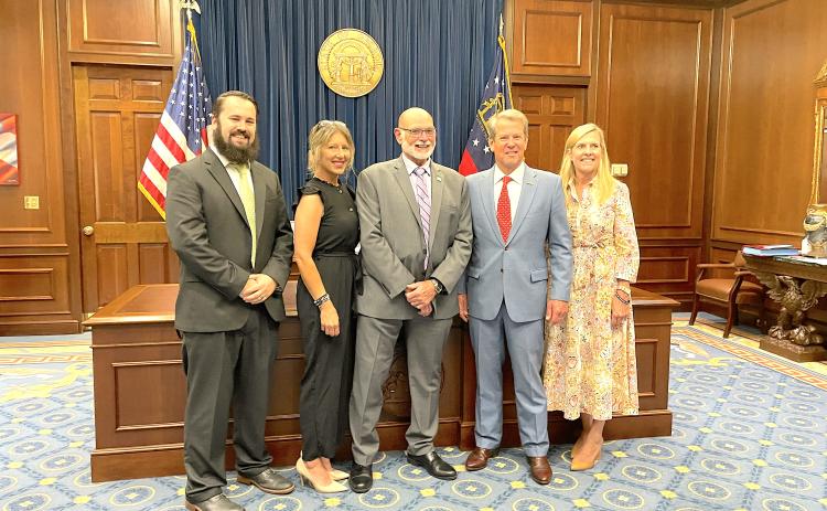 tephens County elections supervisor Bruce Carlisle (center) was appointed to the board of corrections by Gov. Brian Kemp. Pictured, with Carlisle, left to right, are county deputy elections supervisor Isaac Overstreet, Carlisle’s daughter Jennifer Steele, Kemp, and Georgia first lady Marty Kemp.