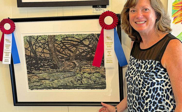 Gail Watson shows off her work entered in the Currahee Artist’s Guild  fall show. She won Exhibitor’s Choice and Best in Show.